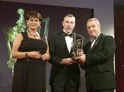24 November 2006; Seamus Moynihan, from Kerry, is presented with his All-Star award by Carolan Lennon, Marketing Director, Vodafone Ireland, and Nickey Brennan, President of the GAA, at the 2006 Vodafone GAA All-Star Awards. Citywest Hotel, Dublin. Picture credit: Brendan Moran / SPORTSFILE