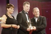 24 November 2006; Ronan Clarke, Armagh, is presented with his All-Star award by Carolan Lennon, Marketing Director, Vodafone Ireland, and Nickey Brennan, President of the GAA, at the 2006 Vodafone GAA All-Star Awards. Citywest Hotel, Dublin. Picture credit: Ray McManus / SPORTSFILE