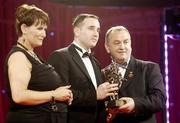 24 November 2006; Eoin Kelly, Tipperary, is presented with his All-Star award by Carolan Lennon, Marketing Director, Vodafone Ireland, and Nickey Brennan, President of the GAA, at the 2006 Vodafone GAA All-Star Awards. Citywest Hotel, Dublin. Picture credit: Ray McManus / SPORTSFILE