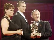 24 November 2006; Tony Griffin, Clare, is presented with his All-Star award by Carolan Lennon, Marketing Director, Vodafone Ireland, and Nickey Brennan, President of the GAA, at the 2006 Vodafone GAA All-Star Awards. Citywest Hotel, Dublin. Picture credit: Ray McManus / SPORTSFILE