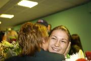 25 November 2006; Katie Taylor is congratulated by Sanie Duffy, Chair person for the women's committee in the IABA, at Dublin airport arriving home from the Fourth Women's World Championships, where she was crowned World Champion. Dublin Airport, Dublin. Picture credit: Ray Lohan / SPORTSFILE