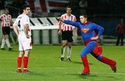 31 October 2006; Superman invades the pitch watched by Michael McNamara, Sligo Rovers. Carlsberg FAI Cup, Semi-Final Replay, Derry City v Sligo Rovers. Brandywell, Derry. Picture credit: Oliver McVeigh / SPORTSFILE