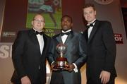 26 November 2006; Winner of the eircom League Premier Division Player of the Year Award Joseph Ndo, centre, Shelbourne, with Michael Savage, left, Advertising Manager of the Mirror Group, and Tony McDonnell, Chairman of the PFAI, 27th PFAI Player Awards. Burlington Hotel, Dublin. Picture credit: David Maher / SPORTSFILE