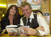 30 November 2006; Golfing Legend Darren Clarke signs a copy of his book 'Heroes All, My Ryder Cup Story 2006' for Louise Martin, from Ballsbridge. Eason's Book Store, O'Connell Street, Dublin. Picture credit: Damien Eagers / SPORTSFILE