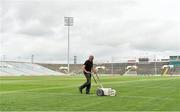 30 August 2014; Groundsman Nick Grene, marks out the thirteen metre line of the pitch ahead of the game. GAA Football All Ireland Senior Championship, Semi-Final Replay, Kerry v Mayo, Gaelic Grounds, Limerick. Picture credit: Barry Cregg / SPORTSFILE