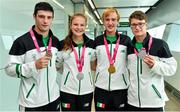 30 August 2014; Team Ireland's, from left: Michael Gallagher, from Finn Valley, Co. Donegal, who won a Bronze medal in Heavyweight boxing; Ciara Ginty, from Geesala, Co. Mayo, who won a Silver medal in lightweight boxing; Michael  Duffy, from Ballina, Co. Mayo, who won a Gold Medal for Team Mix Europe; and Robert Hendrick, from Donadea, Co. Kildare, who won a Silver medal, C1 Obstacle Slalom canoeing, pictured at Dublin Airport on their return from World Youth Olympics in China. Dublin Airport, Dublin. Picture credit: Ramsey Cardy / SPORTSFILE