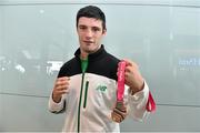 30 August 2014; Team Ireland's Michael Gallagher, from Finn Valley, Co. Donegal, who won a Bronze medal in Heavyweight boxing, pictured at Dublin Airport on their return from World Youth Olympics in China. Dublin Airport, Dublin. Picture credit: Ramsey Cardy / SPORTSFILE