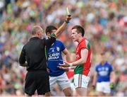 30 August 2014; Cillian O'Connor, Mayo, is issued a yellow card by referee Cormac Reilly. GAA Football All Ireland Senior Championship, Semi-Final Replay, Kerry v Mayo. Gaelic Grounds, Limerick. Picture credit: Stephen McCarthy / SPORTSFILE