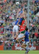 30 August 2014; Johnny Buckley, Kerry, in action against Donal Vaughan, left, and Jason Doherty, Mayo. GAA Football All Ireland Senior Championship, Semi-Final Replay, Kerry v Mayo, Gaelic Grounds, Limerick. Picture credit: Dáire Brennan / SPORTSFILE
