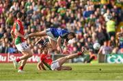 30 August 2014; James O'Donoghue, Kerry, is fouled in the box by Mayo's Ger Cafferkey to win a penalty for his team, which he converted for his side's third goal of the game. GAA Football All Ireland Senior Championship, Semi-Final Replay, Kerry v Mayo. Gaelic Grounds, Limerick. Picture credit: Stephen McCarthy / SPORTSFILE