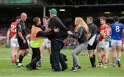 30 August 2014; A disgruntled Mayo supporter is restrained as he tries to confront referee Cormac Reilly during the closing stages of the game. GAA Football All Ireland Senior Championship, Semi-Final Replay, Kerry v Mayo. Gaelic Grounds, Limerick. Picture credit: Diarmuid Greene / SPORTSFILE