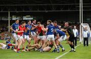 30 August 2014; Kerry and Mayo players clash during extra time as referee Cormac Reilly and his umpires keep watch. GAA Football All Ireland Senior Championship, Semi-Final Replay, Kerry v Mayo. Gaelic Grounds, Limerick. Picture credit: Diarmuid Greene / SPORTSFILE