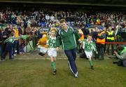 26 November 2006; Mascots Stuart Murless, left, and Jack Jacob with Ireland captain Brian O'Driscoll before the game. Autumn Internationals, Ireland v The Pacific Islands, Lansdowne Road, Dublin. Picture credit: Brendan Moran / SPORTSFILE