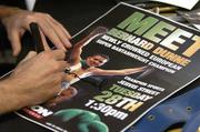 28 November 2006; EBU Super Bantamweight Champion Bernard Dunne signs a poster on a visit to Champion Sports to launch it's Christmas range. Champion Sports, Jervis Street Centre, Dublin. Picture credit: Brian Lawless / SPORTSFILE