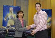 28 November 2006; UCD sports scholarship recipient Peter Finn, Basketball, with Professor Mary Clayton, Vice President for students, at the Sports Scholarships Reception for the announcement of the 2006 scholarship recipients. Astra Hall, Student Centre, University College Dublin, Belfield Campus, Dublin. Picture credit: Damien Eagers / SPORTSFILE