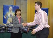 28 November 2006; UCD sports scholarship recipient Peter Finn, Basketball, with Professor Mary Clayton, Vice President for students, at the Sports Scholarships Reception for the announcement of the 2006 scholarship recipients. Astra Hall, Student Centre, University College Dublin, Belfield Campus, Dublin. Picture credit: Damien Eagers / SPORTSFILE