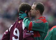 16 April 2006; David Brady, Mayo, kisses Niall Coleman, Galway, during the second half. Allianz National Football League, Division 1 Semi-Final, Mayo v Galway, McHale Park, Castlebar, Co. Mayo. Picture credit: David Maher / SPORTSFILE