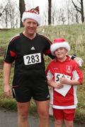 3 December 2006; John McCann and his son Oísin from Ballybrack in Dublin, after competing in the Jingle Bells 5K, Phoenix Park, Dublin. Picture credit: Tomas Greally / SPORTSFILE