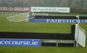 3 December 2006; The safety rail is damaged during the storm at Fairyhouse Racecourse, Ratoath, Co. Meath. Picture credit: Matt Browne / SPORTSFILE
