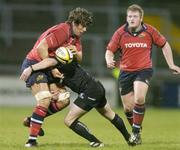 3 December 2006; Donncha O'Callaghan, Munster, is tackled by Keith Matthews, Connacht. Magners League, Munster v Connacht, Thomond Park, Limerick. Picture credit: Brendan Moran / SPORTSFILE