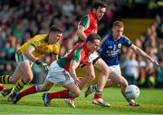 30 August 2014; Andy Moran, Mayo, scores his side's third goal despite the efforts of Kerry's Pa Kilkenny and goalkeeper Brian Kelly. GAA Football All Ireland Senior Championship, Semi-Final Replay, Kerry v Mayo. Gaelic Grounds, Limerick. Picture credit: Diarmuid Greene / SPORTSFILE