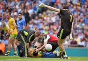 31 August 2014; Rory Kavanagh, Donegal, receives medical attention while his goalkeeper Paul Durcan takes a kick out. GAA Football All Ireland Senior Championship, Semi-Final, Dublin v Donegal, Croke Park, Dublin. Picture credit: Brendan Moran / SPORTSFILE