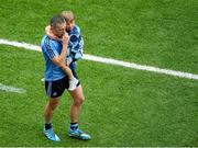 31 August 2014; A dejected Alan Brogan, Dublin, leaves the field with his son Jamie after the game. GAA Football All Ireland Senior Championship, Semi-Final, Dublin v Donegal, Croke Park, Dublin. Picture credit: Dáire Brennan / SPORTSFILE