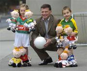 4 December 2006; Mayo manager John O'Mahony with 3 year old Aidan Hegarty and his sister Cara, aged 5, from Armagh, at the launch of 'RUA', the new children's GAA mascot created by Sports Merchandising Ireland Ltd. RUA is a soft toy which comes decked out in your favourite county colours and is available now. Croke Park, Dublin. Picture credit: Pat Murphy / SPORTSFILE