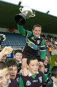 4 December 2006; Sean Tormey, captain of Scoil Fhursa, Coolock, Co. Dublin, celebrates with his team-mate's after winning the U.13's Cora na Cheid cup. Allianz Cumann na mBunscol Finals, Scoil Fhursa v Scoil Ui Chonaill, Parnell Park, Dublin. Picture credit: David Maher / SPORTSFILE