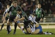 8 December 2006; David Slemen, Connacht, is tackled by Harley Crane and Fulgence Ouedraogo, Montpellier. European Challenge Cup, Pool 4, Round 2, Connacht v Montpellier, Sportsground, Galway. Picture credit: Brian Lawless / SPORTSFILE