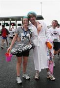 10 December 2006; Martha Murphy and Damien Byrne after the finish of the 2006 Dublin Port Tunnel Race. Port Tunnel, Dublin. Picture credit: Tomas Greally / SPORTSFILE