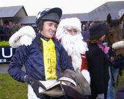 10 December 2006; Barry Geraghy is congratulated by 'Santa Claus' after winning The John Durkan Memorial Punchestown Steeplechase aboard In Compliance. Punchestown Racecourse, Co. Kildare. Picture credit: Brian Lawless / SPORTSFILE
