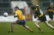 10 December 2006; Justin Walsh, The Nire, in action against Michael Moore, Dr Crokes. AIB Munster Senior Club Football Championship Final, Dr Crokes v The Nire, Pairc Ui Chaoimh, Cork. Picture credit: David Maher / SPORTSFILE