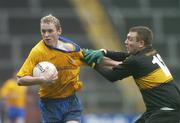 10 December 2006; Maurice O'Gorman, The Nire, in action against James Fleming, Dr Crokes. AIB Munster Senior Club Football Championship Final, Dr Crokes v The Nire, Pairc Ui Chaoimh, Cork. Picture credit: David Maher / SPORTSFILE