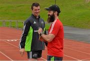 1 September 2014; Munster's Peter O'Mahony in conversation with senior strength and conditioning coach Aled Walters before squad training ahead of their Guinness PRO12 round 1 match against Edinburgh on Friday. Munster Rugby Squad Training, University of Limerick, Limerick. Picture credit: Diarmuid Greene / SPORTSFILE