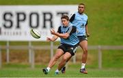 1 September 2014; Munster's Ian Keatley, supported by team-mate Simon Zebo, in action during squad training ahead of their Guinness PRO12 round 1 match against Edinburgh on Friday. Munster Rugby Squad Training, University of Limerick, Limerick. Picture credit: Diarmuid Greene / SPORTSFILE