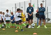 1 September 2014; Republic of Ireland players David Meyler, Robbie Brady and Anthony Pilkington today visited the eFlow FAI Summer Soccer Schools Golden Camp in Gannon Park, Malahide. This year’s Summer Soccer Schools proved to be the FAI’s most successful ever, with over 23,000 participants on more than 330 camps nationwide. A special Golden Camp was held for those who participated on a 2014 eFlow FAI Summer Soccer School and purchased a 2014 FAI Season Ticket. Golden Camp participants were coached by FAI international coaching staff, watched senior men’s team training and met players afterwards. Participants were also coached by Rachel Graham from our senior women’s squad alongside Robbie Brady, Anthony Pilkington and Summer Soccer Schools Ambassador David Meyler. See summersoccerschools.ie for details. Pictured at the camp is Zach Brady, aged 7, from Ashbourne, Co. Meath. Gannon Park, Malahide, Co. Dublin. Picture credit: Ramsey Cardy / SPORTSFILE