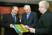 11 December 2006; An Taoiseach Bertie Ahern T.D. with Nickey Brennan, left, President of the GAA and Ray McManus of Sportsfile, at the book launch of A Season of Sundays 2006. This is the 10th Edition of A Season of Sundays, a collection of images from the 2006 Gaelic Games year by Sportsfile photographers. Jurys Croke Park Hotel, Jones' Road, Dublin. Picture credit: Brendan Moran / SPORTSFILE