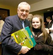 11 December 2006; An Taoiseach Bertie Ahern T.D. with Jude Maher, age 12, from Kilcock, Co. Kildare, at the book launch of A Season of Sundays 2006. This is the 10th Edition of A Season of Sundays, a collection of images from the 2006 Gaelic Games year by Sportsfile photographers. Jurys Croke Park Hotel, Jones' Road, Dublin. Picture credit: Brendan Moran / SPORTSFILE