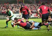 16 December 2006; Denis Leamy, Munster, scores his side's first try despite the tackle of Xavier Rush, Cardiff Blues. Heineken Cup 2006-2007, Pool 4, Round 3, Munster v Cardiff Blues, Thomond Park, Limerick. Picture credit: Kieran Clancy / SPORTSFILE