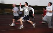 25 December 2006; David Crowley, from Killiney, Co. Dublin, races to the finish line near the end of one of the many Goal Miles taking place nationwide. Annual Goal Mile, Belfield, University College, Dublin. Picture credit: Ray McManus / SPORTSFILE