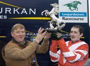 26 December 2006; Bernard Byrne, representing the Slaneyville syndicate, lifts the trophy with jockey Roger Loughran after Schindlers Hunt had won the Durkan New Homes Novice Steeplechase. Leopardstown Racecourse, Leopardstown, Dublin. Picture credit: Pat Murphy / SPORTSFILE