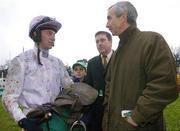 27 December 2006; Jockey Niall 'Slippers' Madden talks to trainer Martin Brassil after winning the Paddy Power Dial-A-Bet Steeplechase aboard Nickname. Leopardstown Racecourse, Leopardstown, Dublin. Picture credit: Brian Lawless / SPORTSFILE