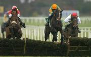 27 December 2006; Eventual  first De Valira, with Andrew Lynch up, left, clears the last alongside eventual second place Catch Me, Barry Geraghty up, centre, and eventual third place Sizing Europe, with Dennis O'Regan up, on their way to winning the paddypower.com Future Champions Novice Hurdle. Leopardstown Racecourse, Leopardstown, Dublin. Picture credit: Brian Lawless / SPORTSFILE