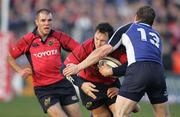 27 December 2006;  Trevor Halstead, Munster, is tackled by Brian O'Driscoll, Leinster. Magners League, Munster v Leinster, Thomond Park, Limerick. Picture credit: Kieran Clancy / SPORTSFILE