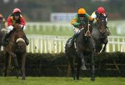 27 December 2006; Eventual first De Valira, with Andrew Lynch up, left, races alongside eventual second place Catch Me, Barry Geraghty up, centre, and eventual third place Sizing Europe, Dennis O'Regan up, on their way to winning the paddypower.com Future Champions Novice Hurdle. Leopardstown Racecourse, Leopardstown, Dublin. Picture credit: Brian Lawless / SPORTSFILE