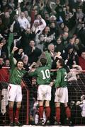 30 December 2006; Glentoran Captain Paul Leeman looks  back to his team-mates while goalscorer Gary Hamilton, centre, and Colin Nixon cheer at the fans. Carnegie Premier League, Glentoran v Portadown, The Oval, Belfast, Co. Antrim. Picture credit: Russell Pritchard / SPORTSFILE