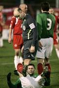 30 December 2006; Referee Mark Courtney looks down at the injured Gary Hamilton. Carnegie Premier League, Glentoran v Portadown, The Oval, Belfast, Co. Antrim. Picture credit: Russell Pritchard / SPORTSFILE