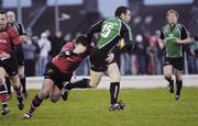 31 December 2006; Daniel Riordan, Connacht, is tackled by James Coughlan, Munster. Magners League, Connacht v Munster, Sportsground, Co. Galway. Picture credit: Ray McManus / SPORTSFILE
