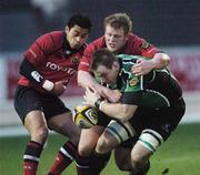 31 December 2006; Connacht's Colm Rigney in action against Munsters Darragh Hurley and Lifeimi Mafi. Magners League, Connacht v Munster, Sportsground, Co. Galway. Picture credit: Ray Ryan / SPORTSFILE